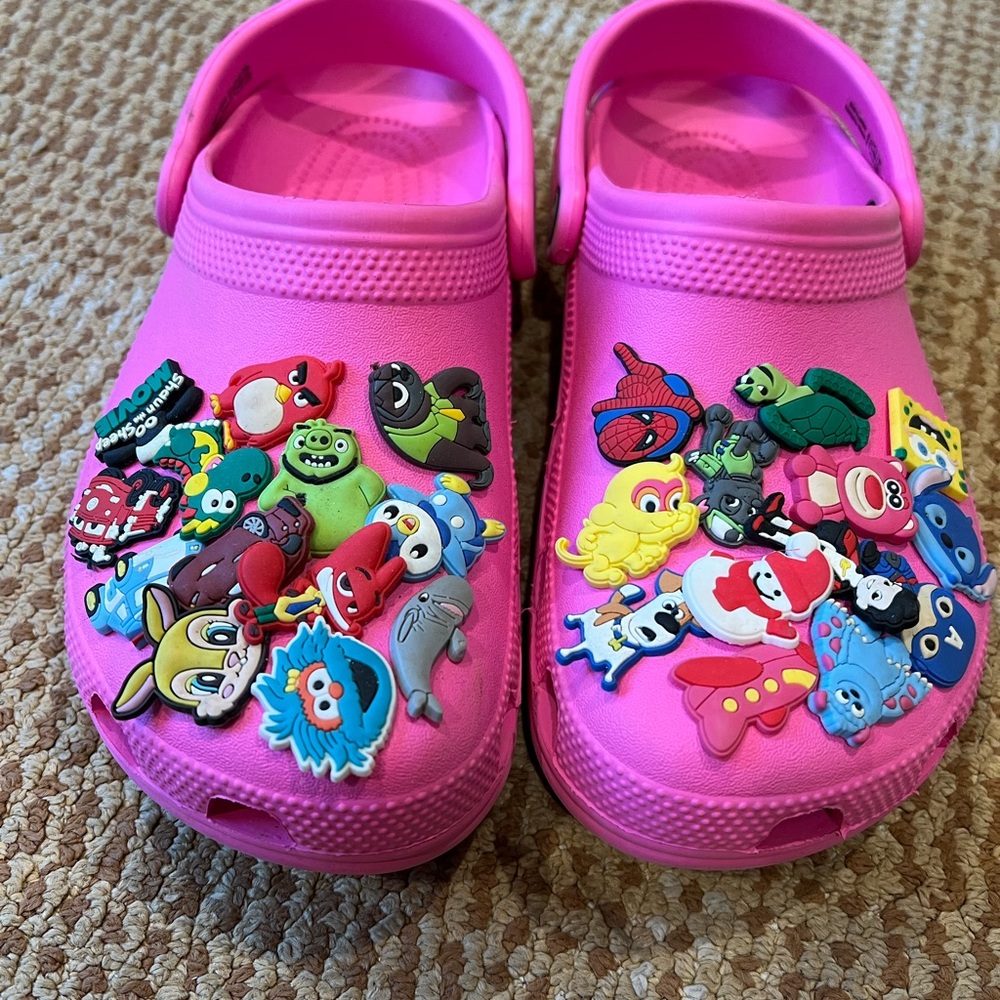 Crocs with assorted Jibbetz!!  Hot pink authentic Crocs in very good condition